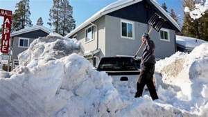 Californian man shoveling piles of snow