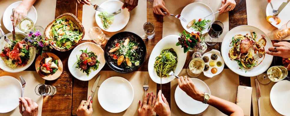 People eating at a full table